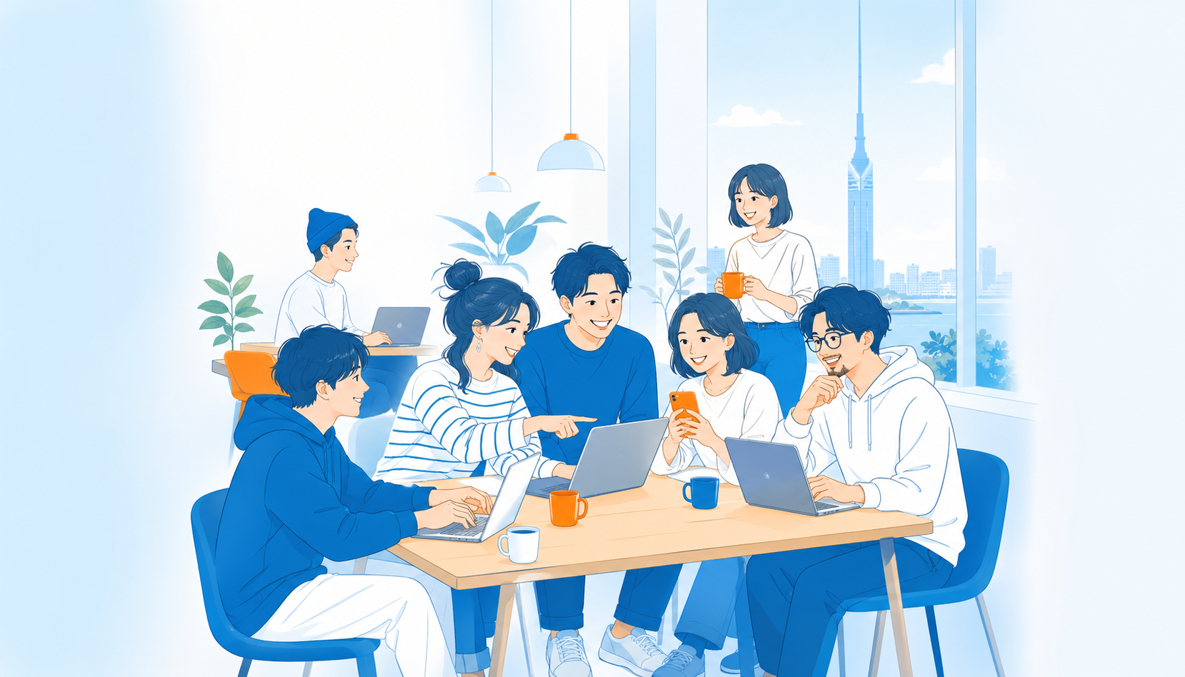 福岡の明るい部屋でノートPCを囲んで話す参加者たち